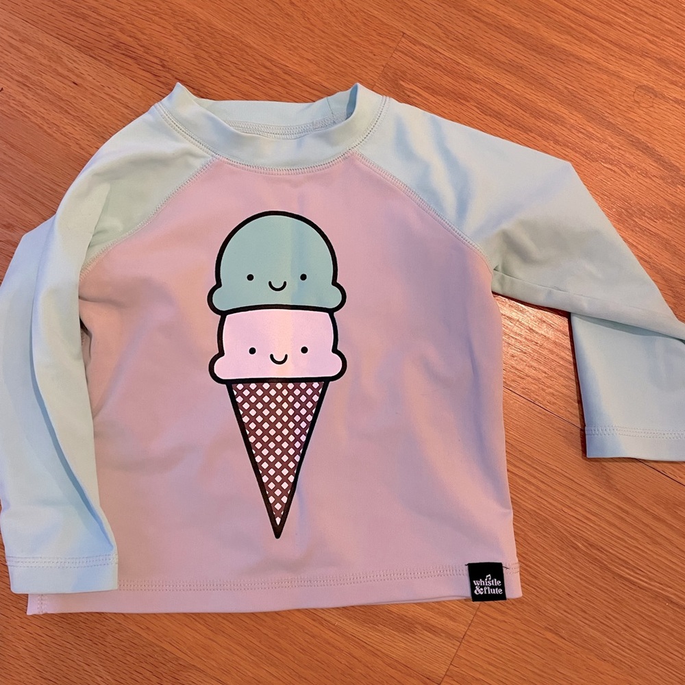 Rash guard by Whistle and Flute
